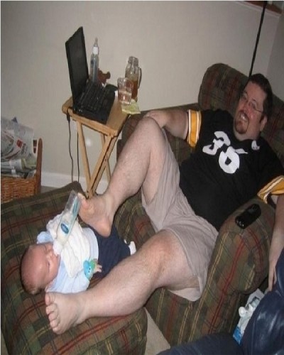 Father Feeding Baby with his Foot