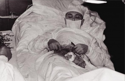 This Photo of a Doctor doing a Surgery on Himself