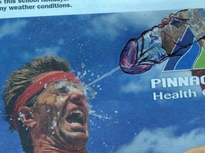 Drawing a penis on a newspaper