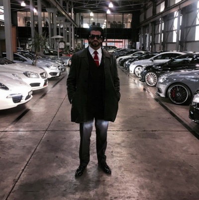 Flaunting His Fleet of Cars