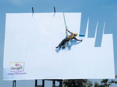 He is Painting Sky on a Billboard