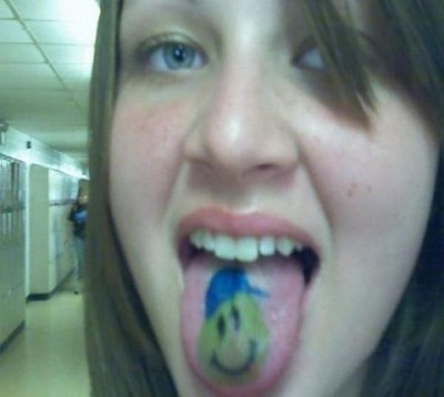 Smiley face tongue tat